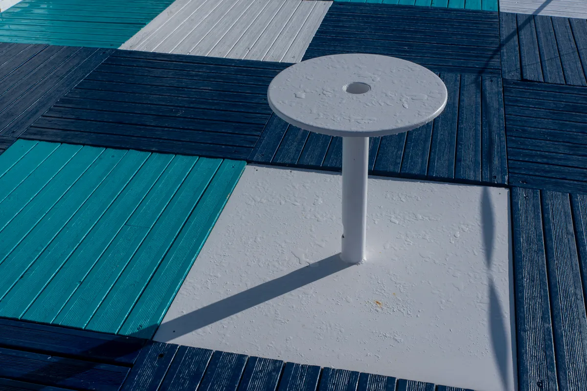 Custom wooden deck with a built-in seating layout and patterned decking